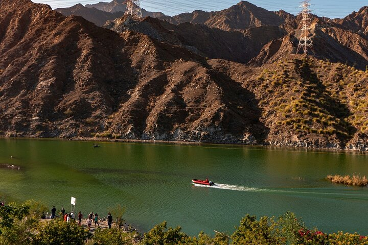 Discover the serene beauty of Khorfakkan's waters as you glide by stunning mountains enjoying the peaceful landscape with friends or family on this private adventure through nature’s wonders.